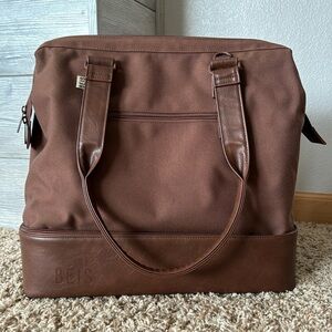BEIS Mini Weekender in maple color.
